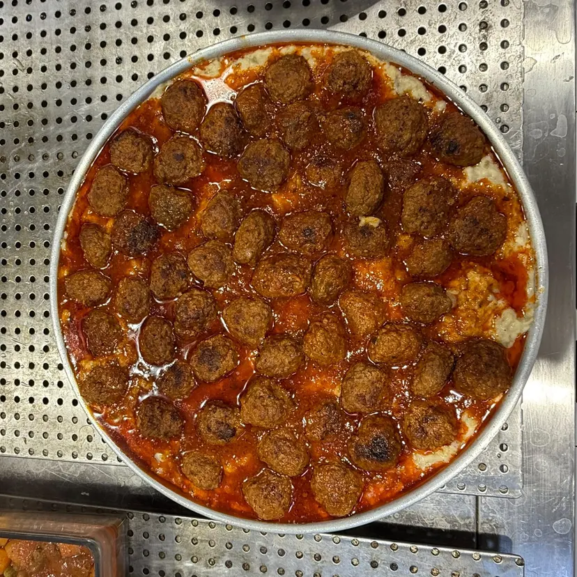 Beğendili Köfte (Meatballs on Smoked Eggplant Purée) cooked daily at Nezaf Ev Yemekleri in Nişantaşı, the whole tray on the hot counter