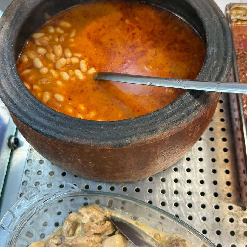 Kuru Fasulye (White Bean Stew), cooked daily at Nezaf Ev Yemekleri in Nişantaşı, in its clay pot on the hot counter