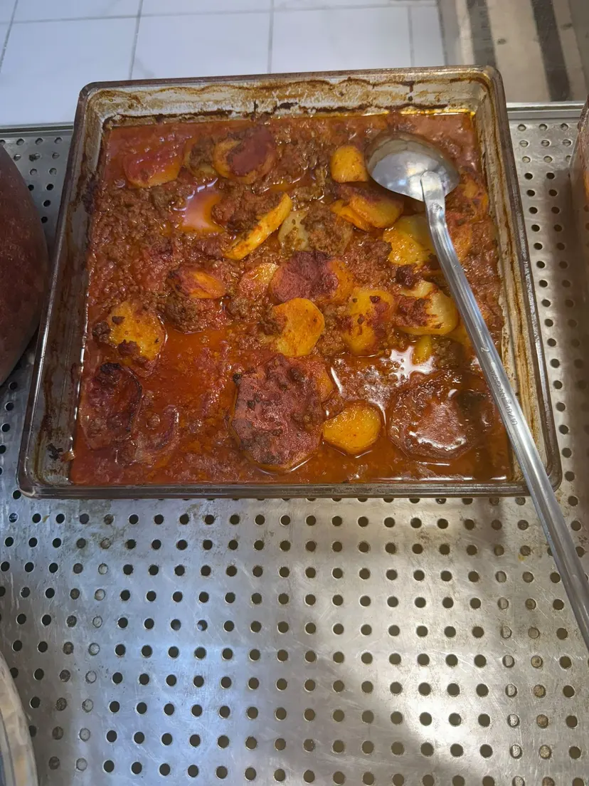 Patates Oturtma (Potato and Ground Meat Bake), cooked daily at Nezaf Ev Yemekleri in Nişantaşı, in its baking dish on the hot counter