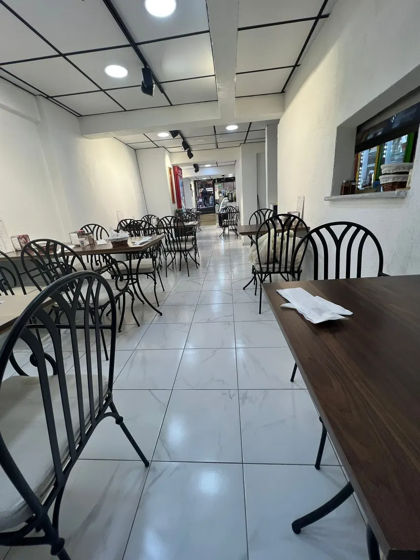 The dining room at Nezaf Ev Yemekleri, seen from the garden toward the entrance