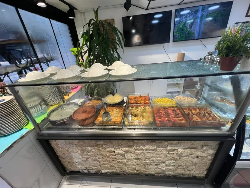 The hot counter and glass case at Nezaf Ev Yemekleri