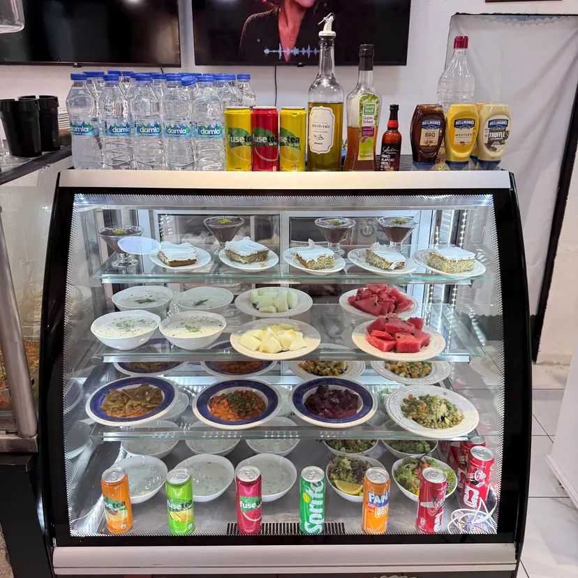 Olive oil dishes, salads and desserts in the cold case at Nezaf Ev Yemekleri